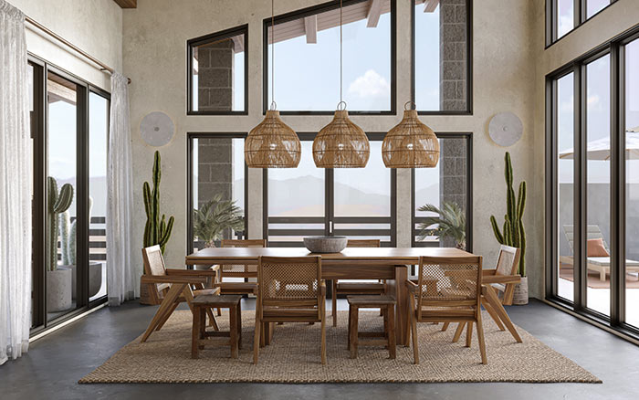 Dining room with stone flooring and wooden furniture.